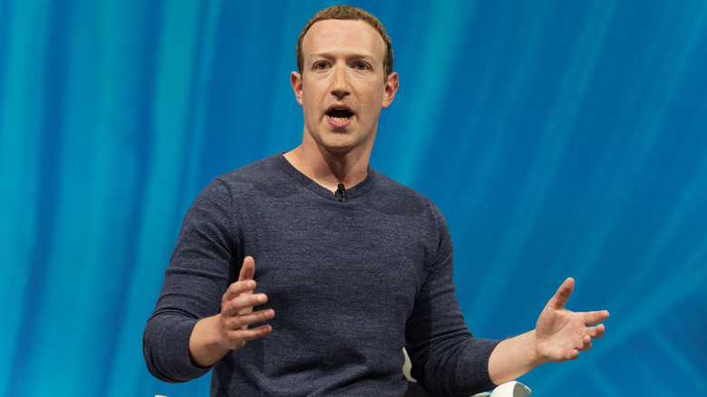 Mark Zuckerberg hands up