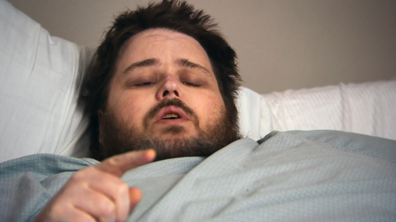 James King lying in bed