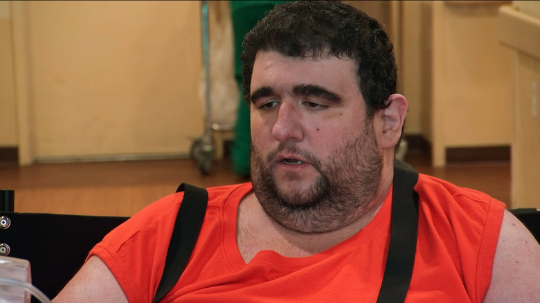 Robert Buchel wearing an orange shirt