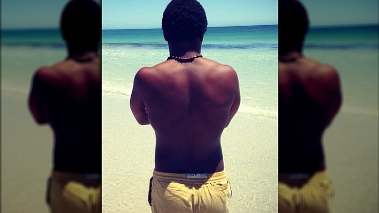 Mzi "Zee" Dempers looking at the ocean 
