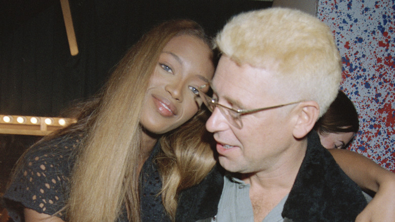 Naomi Campbell and Adam Clayton embracing