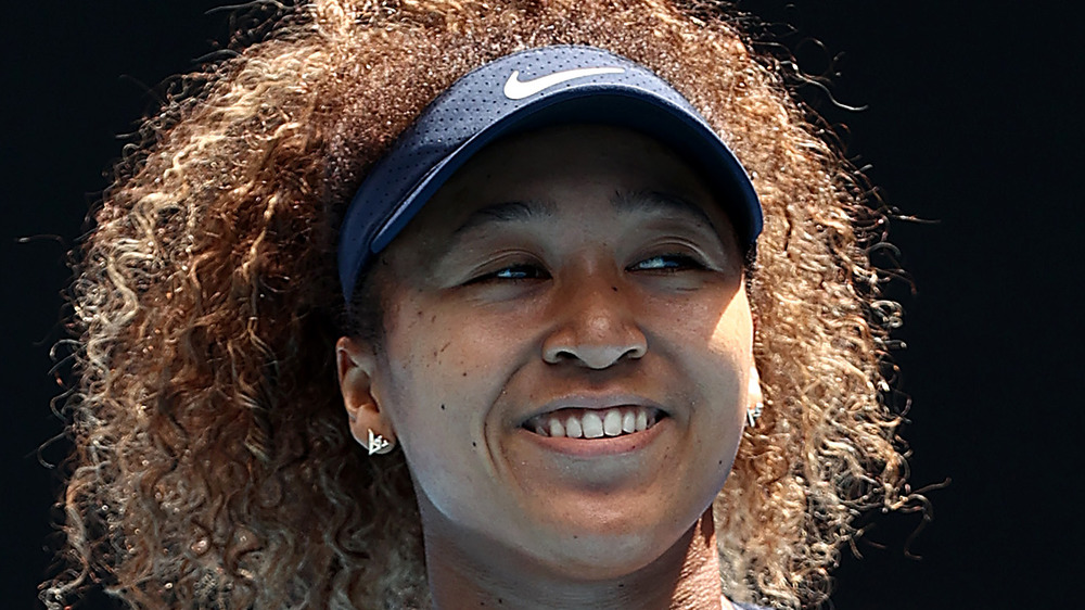 Naomi Osaka smiling after win