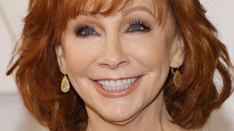 Reba McEntire smiles in earrings