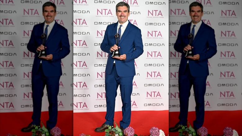 Jeff Hordley posing with his award at the 2026 NTAs.