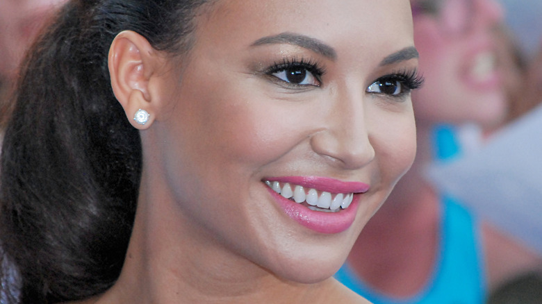 Naya Rivera smiling and looking to the side