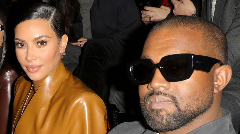 Kim Kardashian and Kanye West attend the Balenciaga show