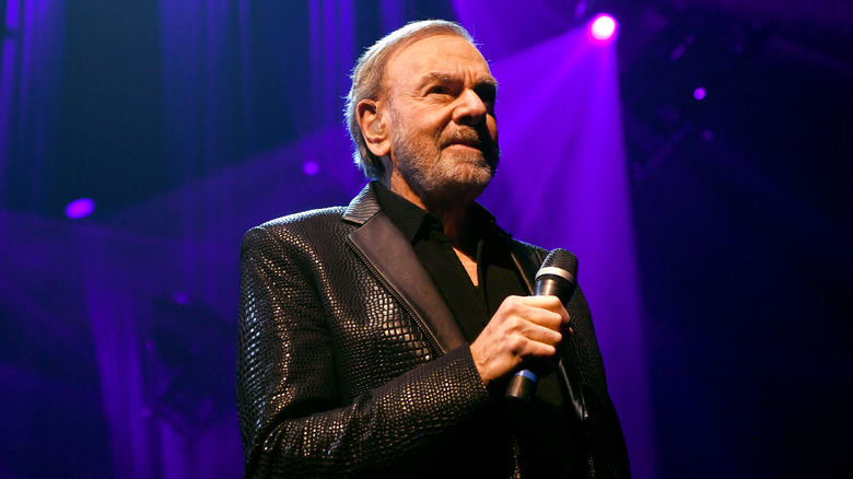 Neil Diamond holding microphone