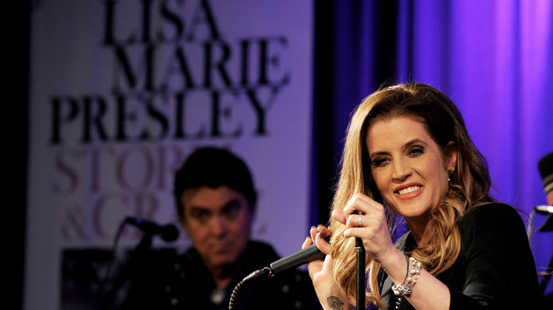 Lisa Marie Presley holding microphone