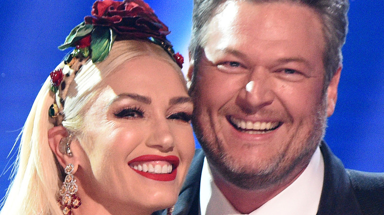 Gwen Stefani and Blake Shelton pose onstage during the 62nd Annual GRAMMY Awards 