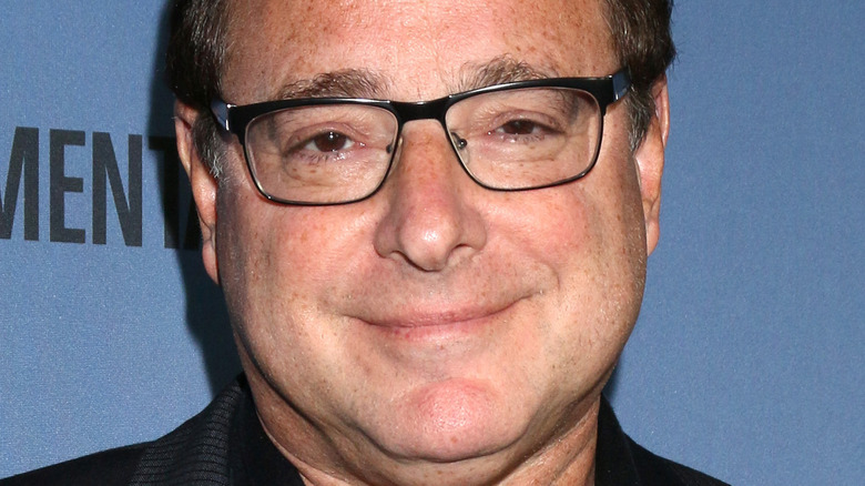 Bob Saget smiles on the red carpet