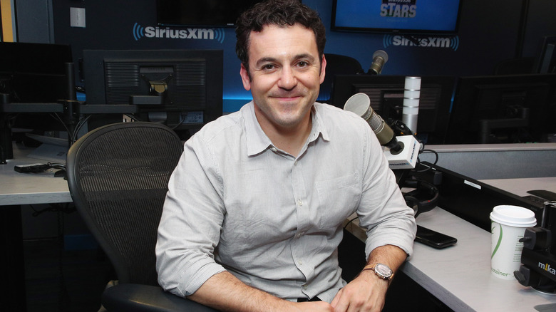 Fred Savage sitting