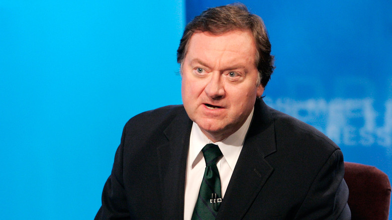 Tim Russert presenting a show