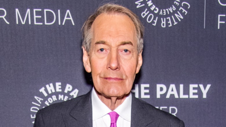 Charlie Rose posing