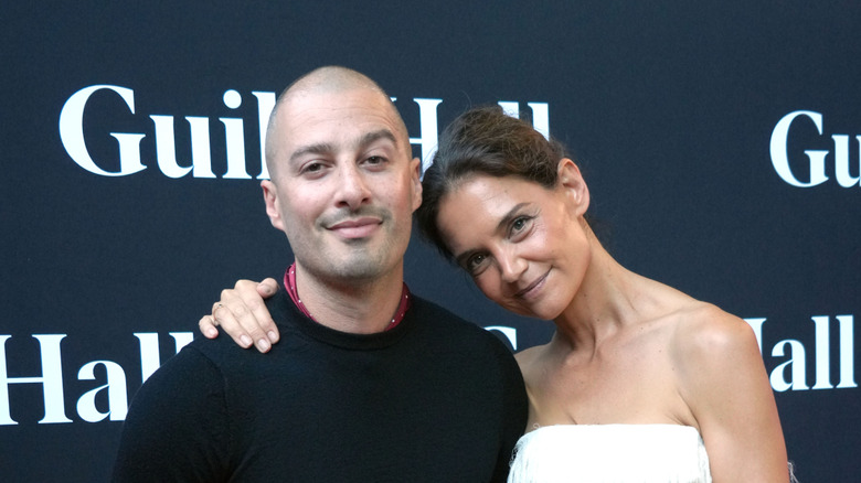 Katie Holmes posing with beau Jason Bard Yarmosky at an event