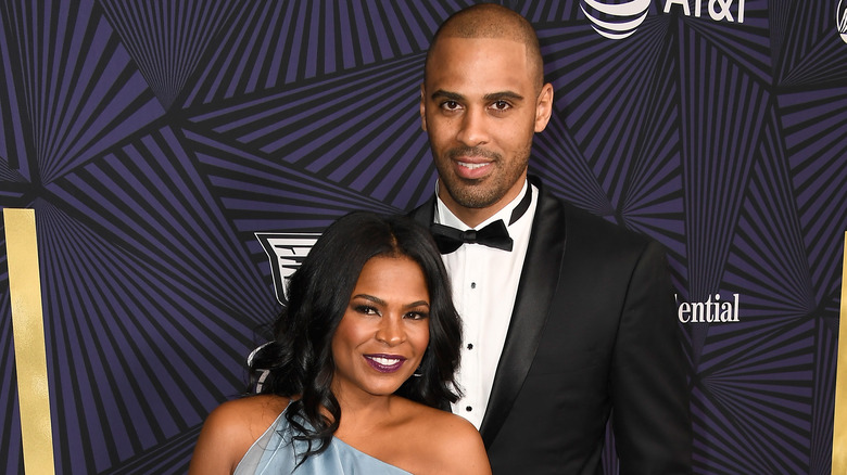 Ime Udoka and Nia Long smiling and posing together