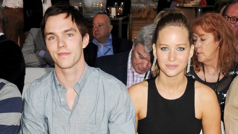 Nicholas Hoult and Jennifer Lawrence seated and smiling