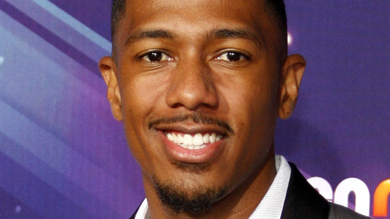 Nick Cannon posing for a picture