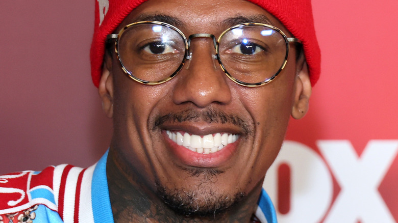 Nick Cannon wearing glasses and headband