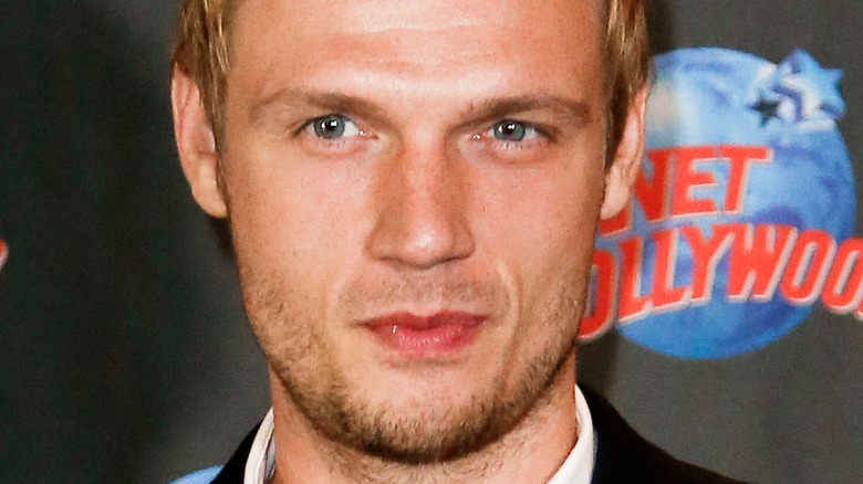 Nick Carter posing on red carpet