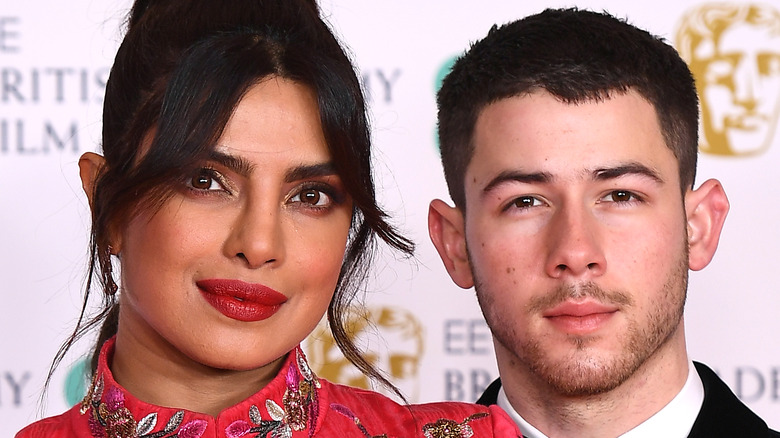 Priyanka Chopra and Nick Jonas pose for a picture at an event