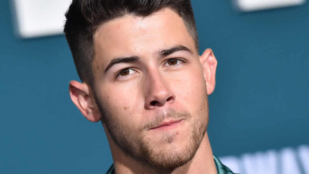 Nick Jonas tilting head