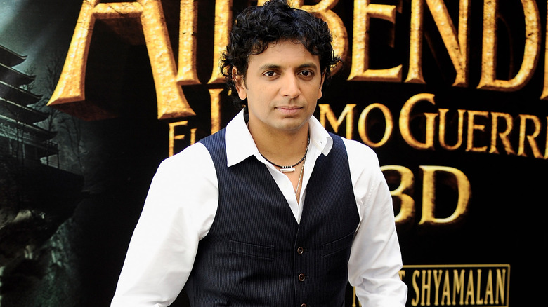 M. Night Shyamalan smirking 