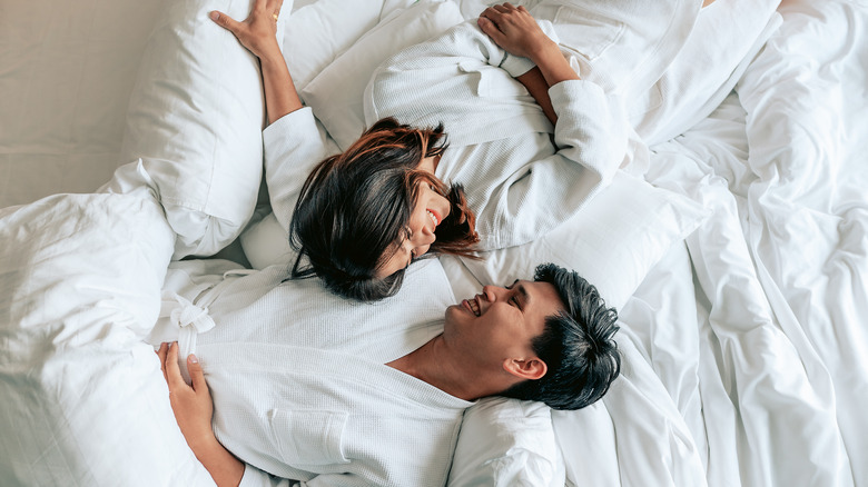 Couple relaxing in bed