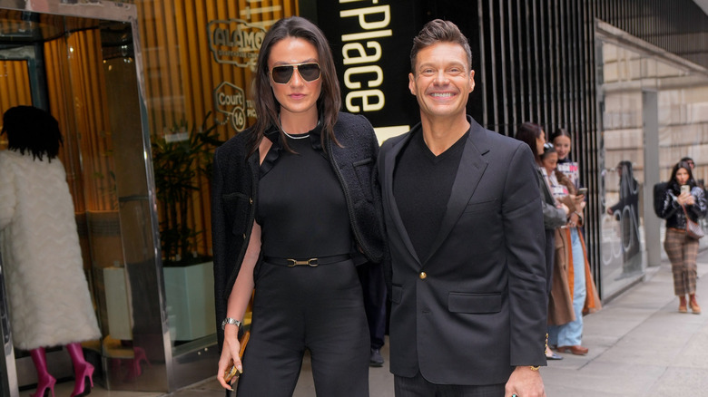 Ryan Seacrest and Aubrey Paige on the sidewalk