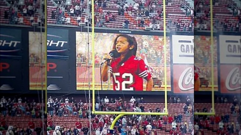 H.E.R. singing