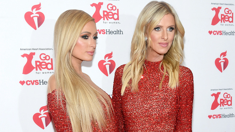 Paris and Nicky Hilton red dresses