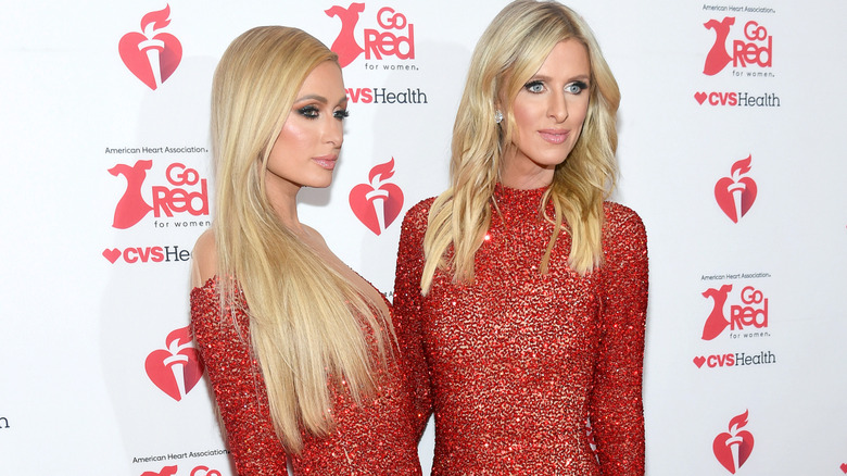Paris and Nicky Hilton red dresses