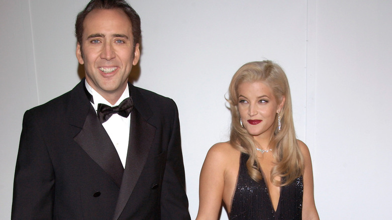 Nicolas Cage and Lisa Marie Presley hold hands