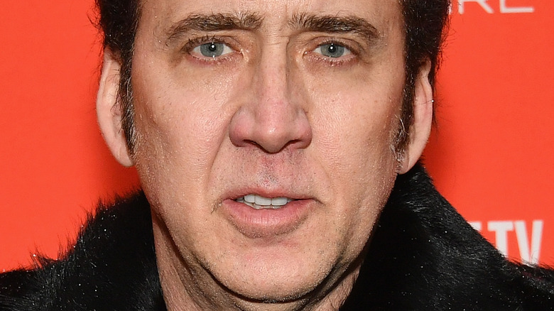 nicolas cage black fur coat