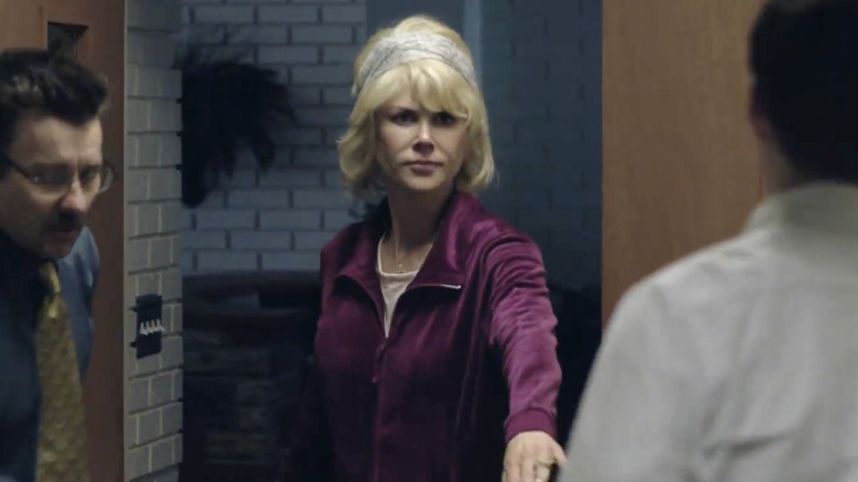 Nicole Kidman looking angry with short blond hair.