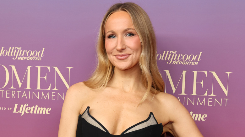 Nikki Glaser wearing a white dress