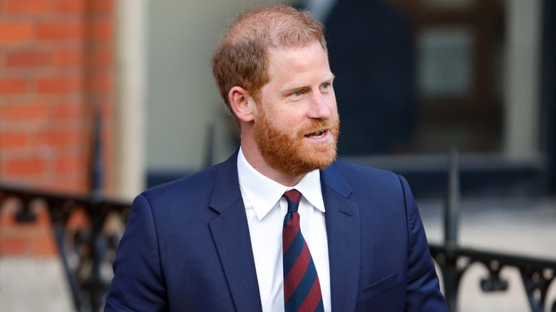 Prince Harry wearing a suit and tie