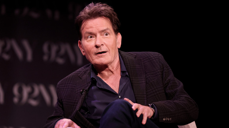 Charlie Sheen speaking on stage in 2025.