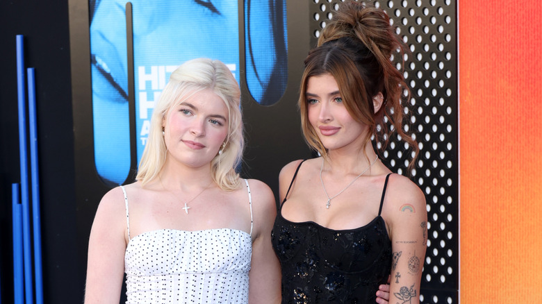 Sami and Lola Sheen pose together on the red carpet.