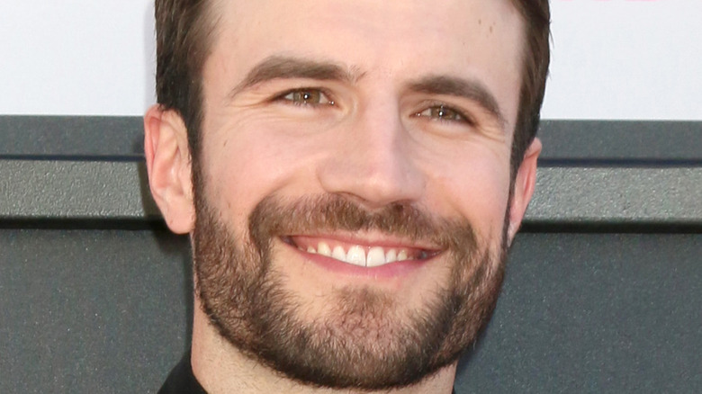 Sam Hunt smiling on the red carpet