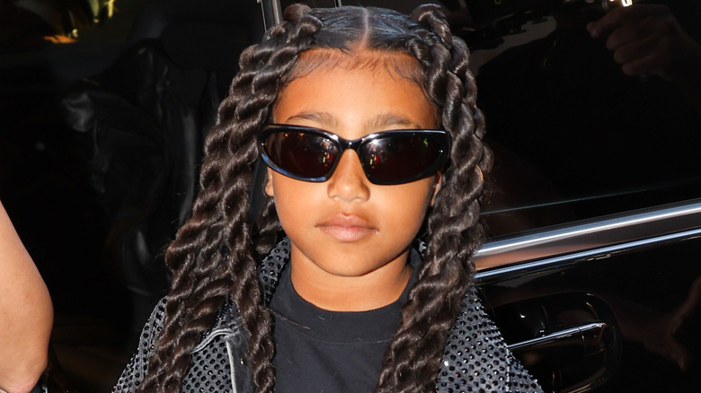 North West, wearing sunglasses