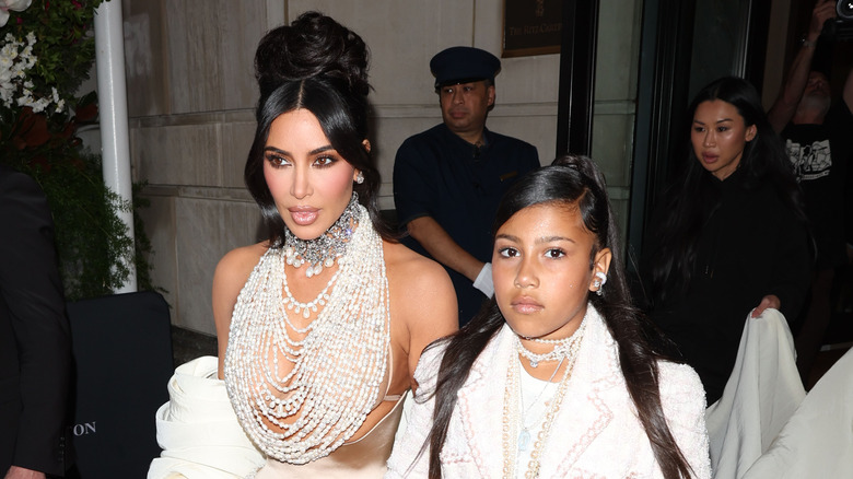 Kim Kardashian and North West posing at an event