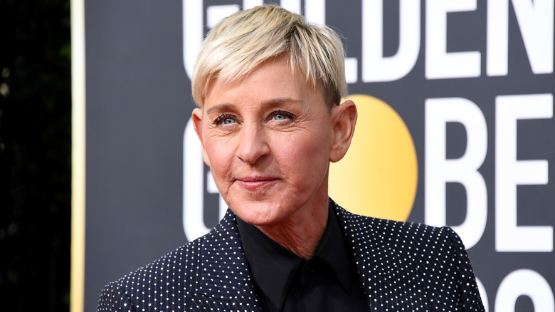 Ellen DeGeneres on the red carpet in a black and white polka-dot blazer.