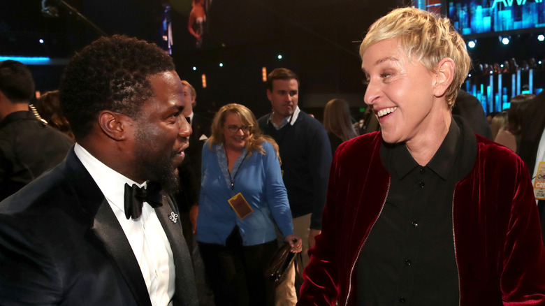 Kevin Hart and Ellen DeGeneres speaking to each other.