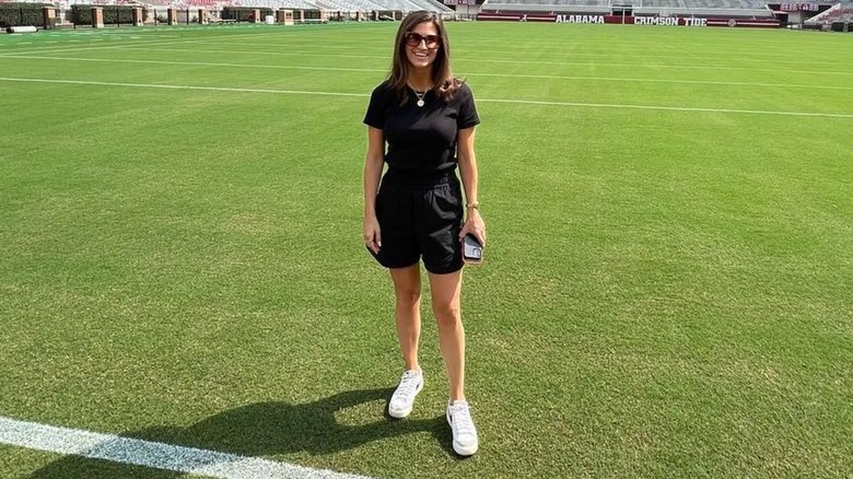 Kaitlan Collins smiling on a football field