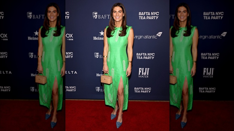 Kaitlan Collins posing in a bright green dress