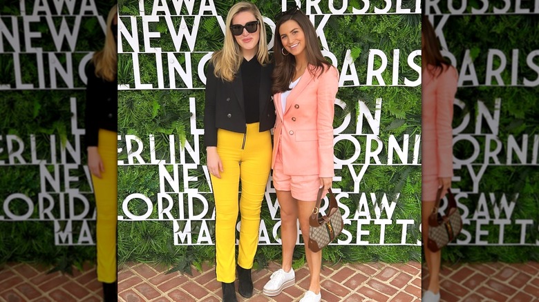 Kaitlan Collins posing with a friend at an event