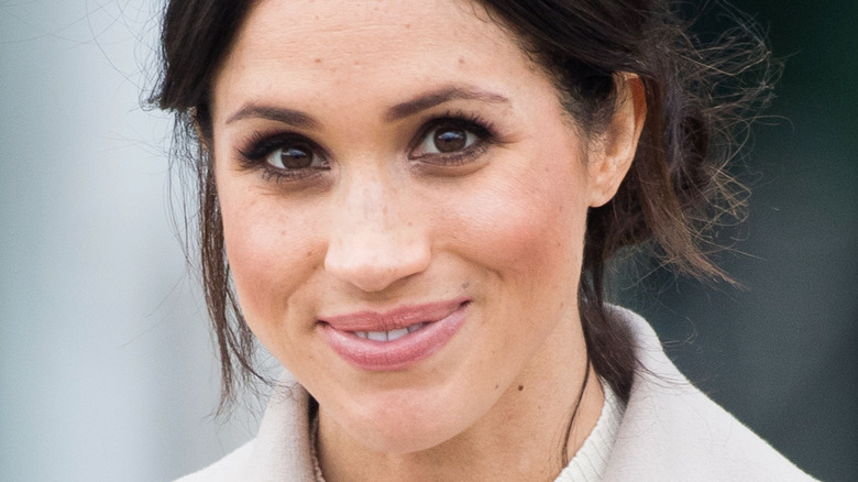 Meghan Markle smiles