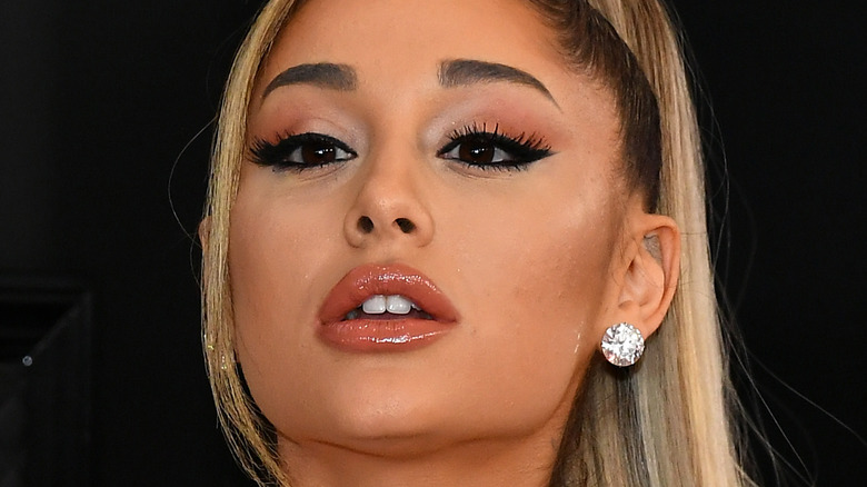 Ariana Grande wearing diamond earrings