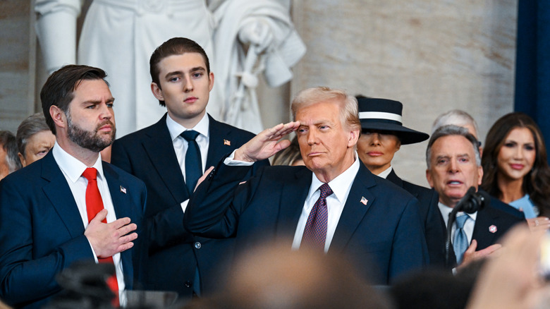 Barron Trump with Donald Trump and JD Vance.