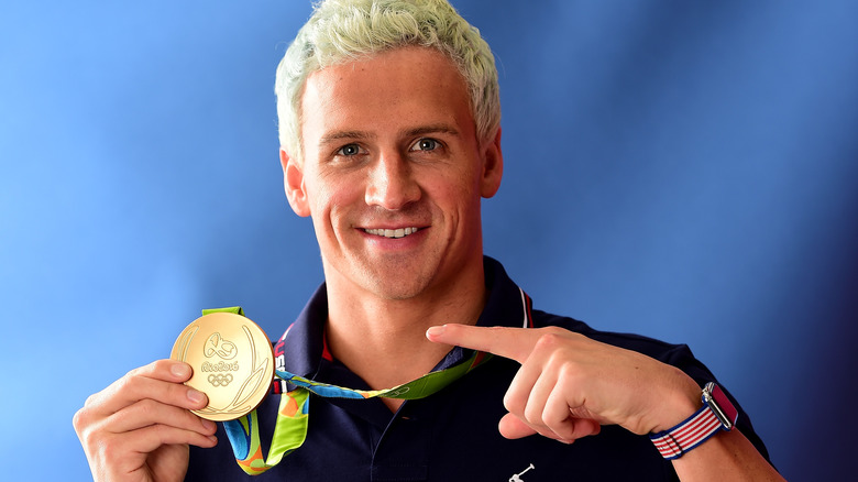 Ryan Lochte smiling with medal